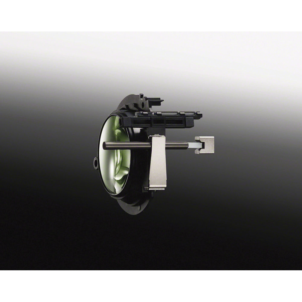 Lente Sony FE 90mm Macro G OSS detallado con su mecanismo interno y montura, visto de lado sobre fondo degradado.